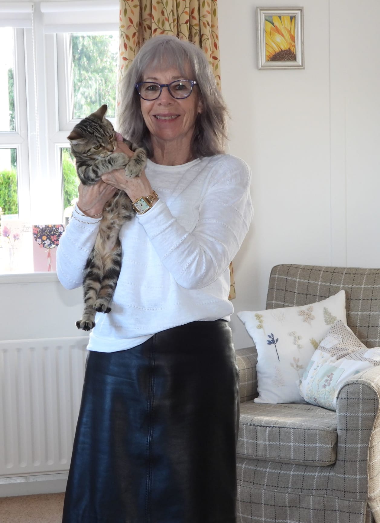 Picture of Lizzie Gumley, one of our Mindfulness for Health bursary recipients, with her cat