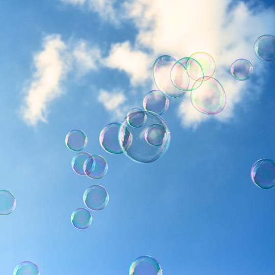 Bubbles in a blue sky with clouds